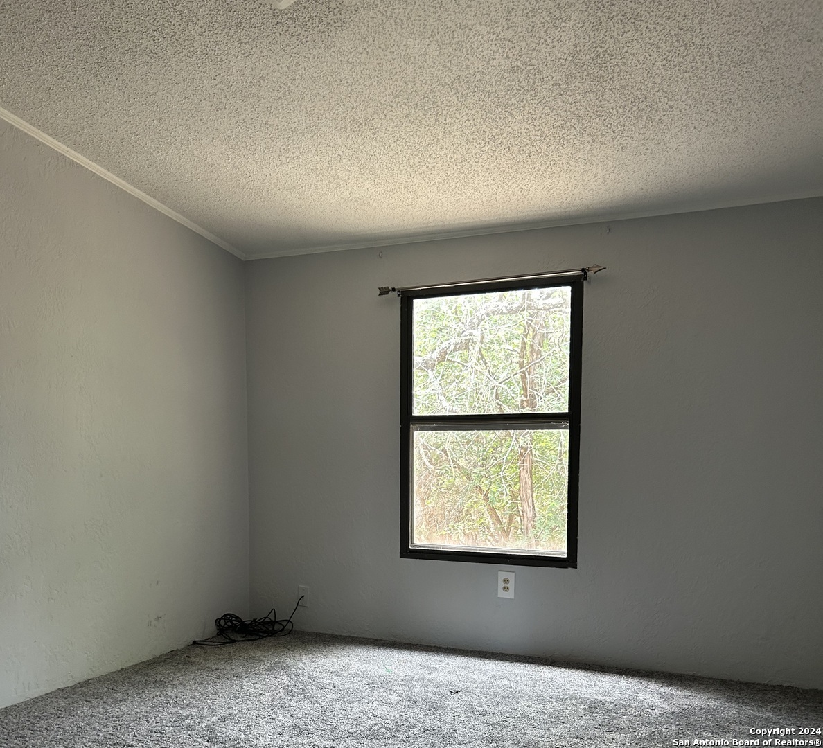 454 Overland Trail Bandera, TX 78003 - Photo 12 of 24 an empty room with a window