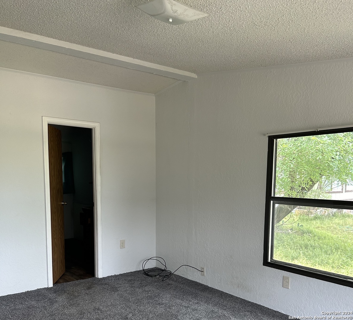 454 Overland Trail Bandera, TX 78003 - Photo 8 of 24 a view of room with window