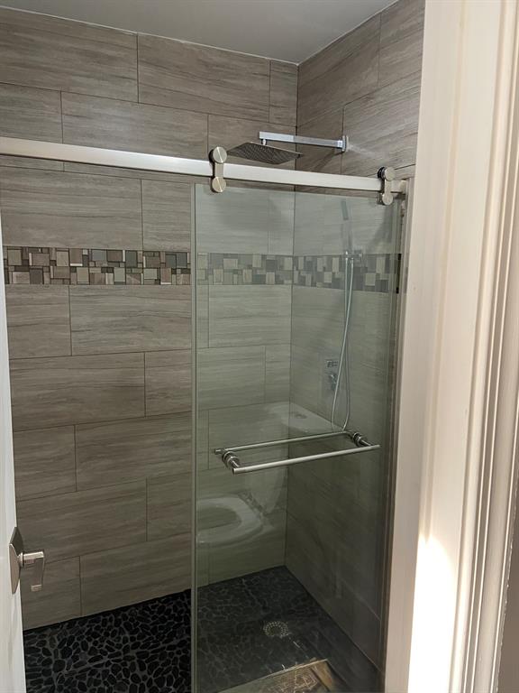 9138 Bedford Drive Boca Raton, FL 33434 - Photo 11 of 21 a bathroom with a shower