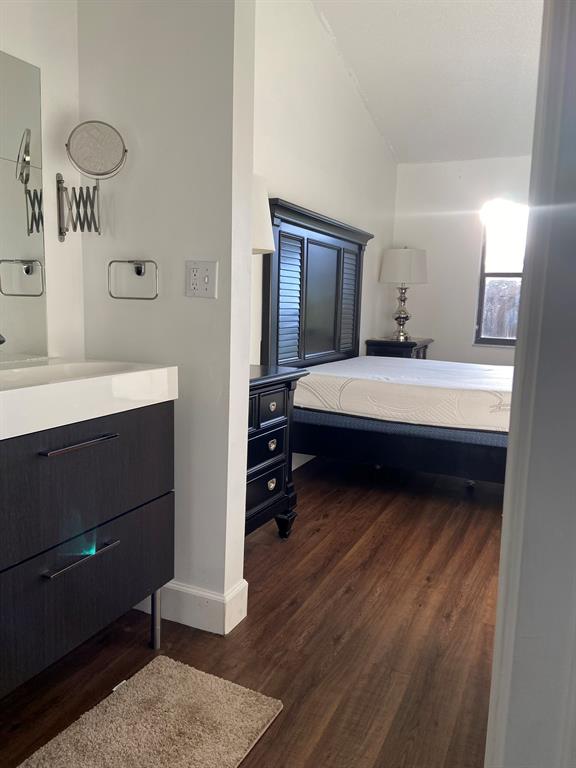 9138 Bedford Drive Boca Raton, FL 33434 - Photo 12 of 21 a bedroom with a bed and a mirror