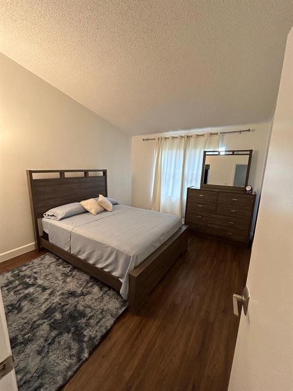 9138 Bedford Drive Boca Raton, FL 33434 - Photo 14 of 21 a bedroom with a bed and window