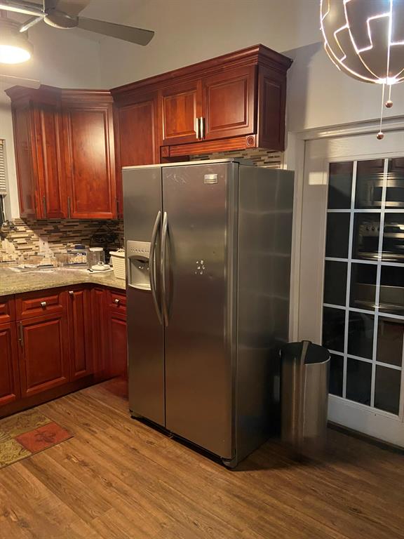 9138 Bedford Drive Boca Raton, FL 33434 - Photo 8 of 21 a kitchen with stainless steel appliances granite countertop a refrigerator and a sink