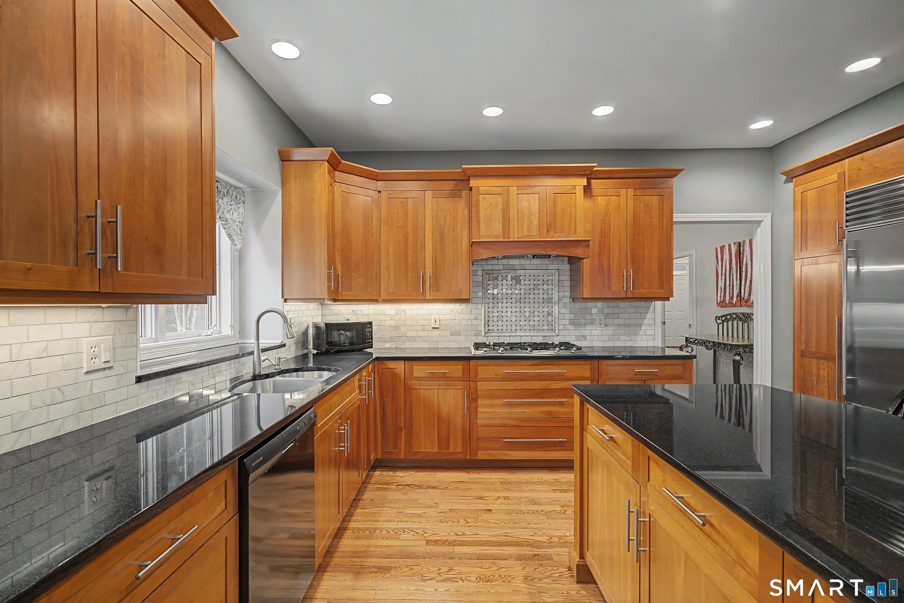 445 Dublin Road Southbury, CT 06488 - Photo 11 of 40 a kitchen with stainless steel appliances granite countertop a sink a stove and cabinets