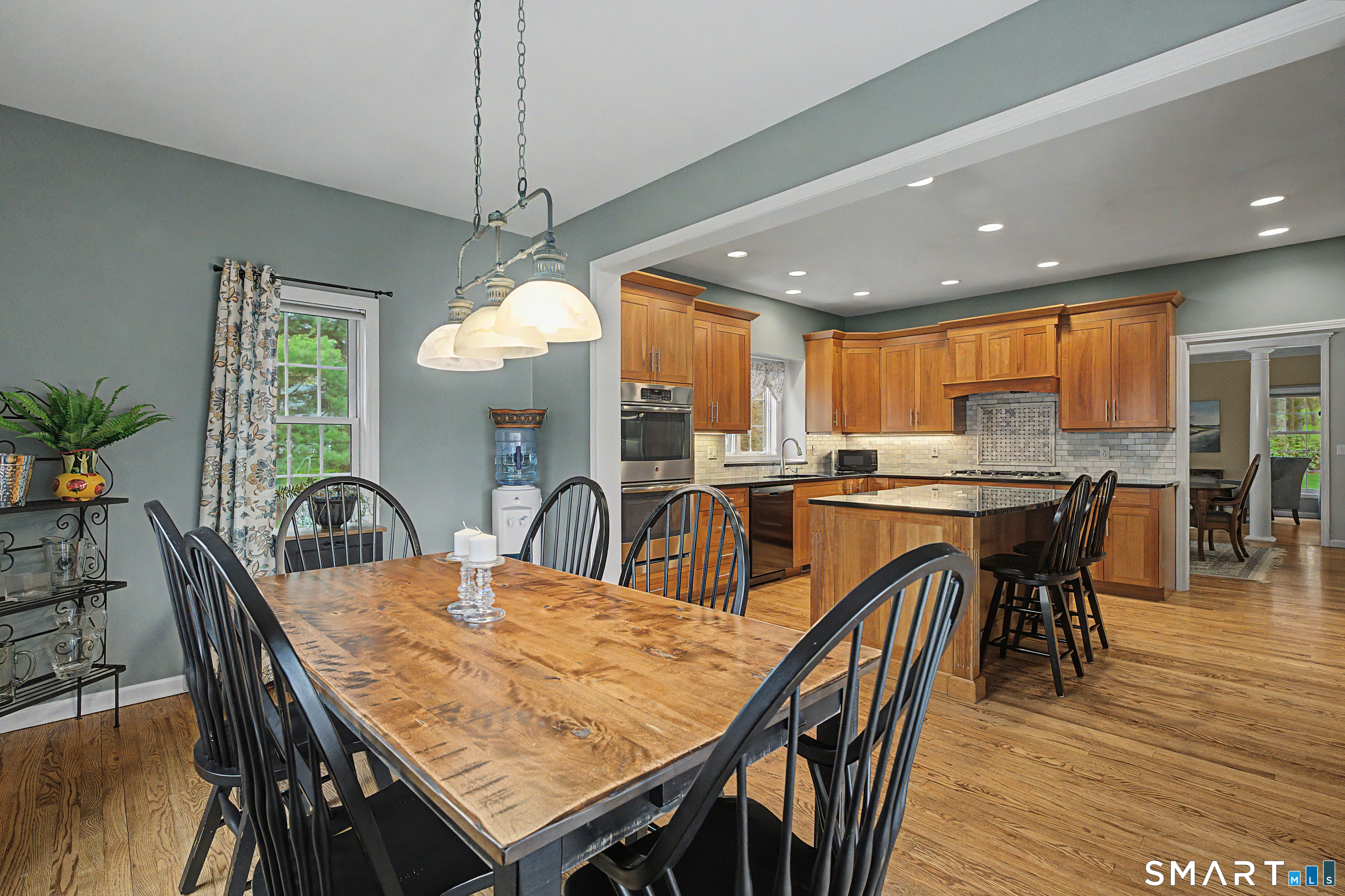 445 Dublin Road Southbury, CT 06488 - Photo 12 of 40 a dining room with stainless steel appliances granite countertop a table chairs and a kitchen view