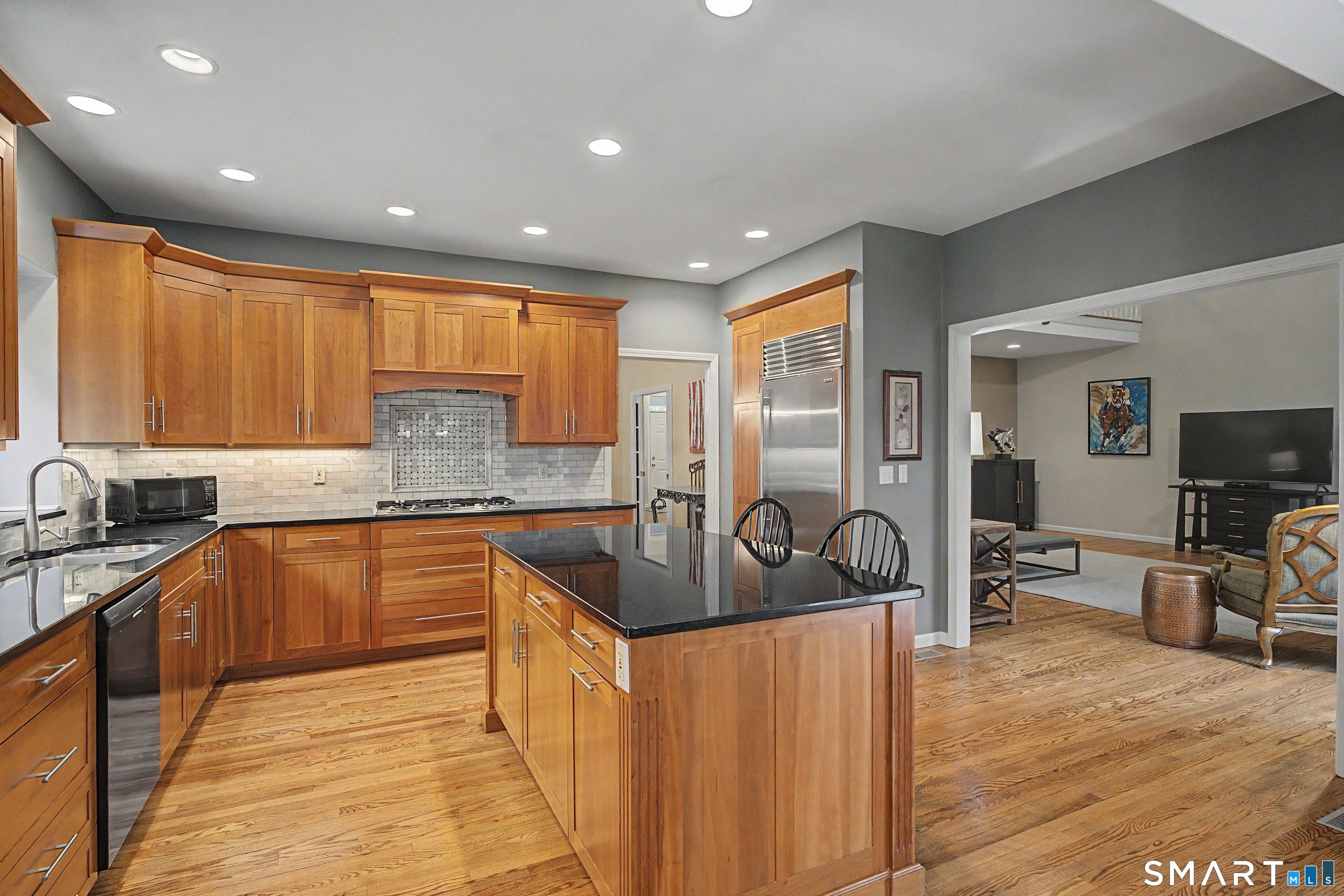 445 Dublin Road Southbury, CT 06488 - Photo 13 of 40 a kitchen with granite countertop a sink stove and cabinets