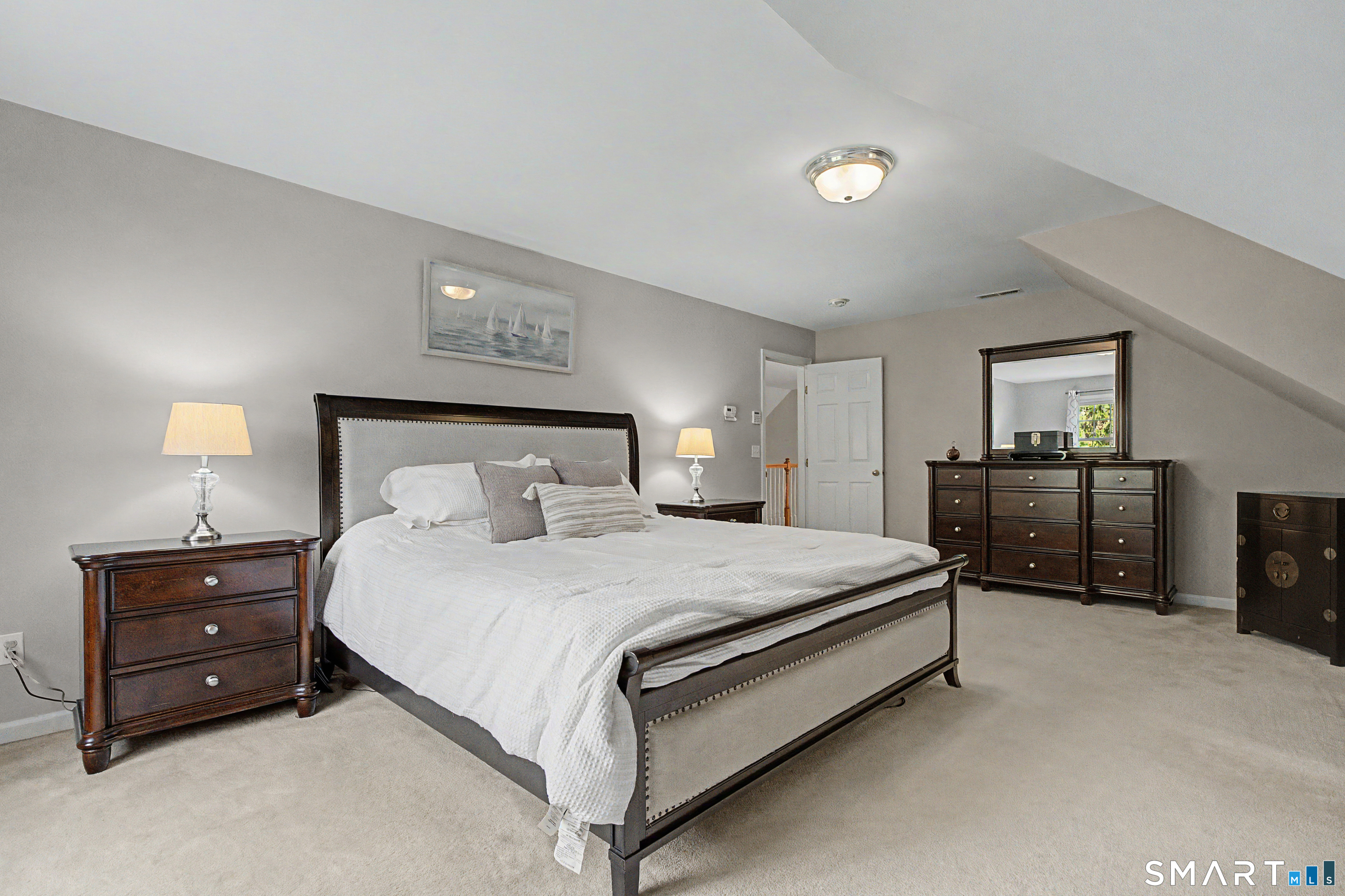 445 Dublin Road Southbury, CT 06488 - Photo 19 of 40 a bedroom with a bed and a night stand