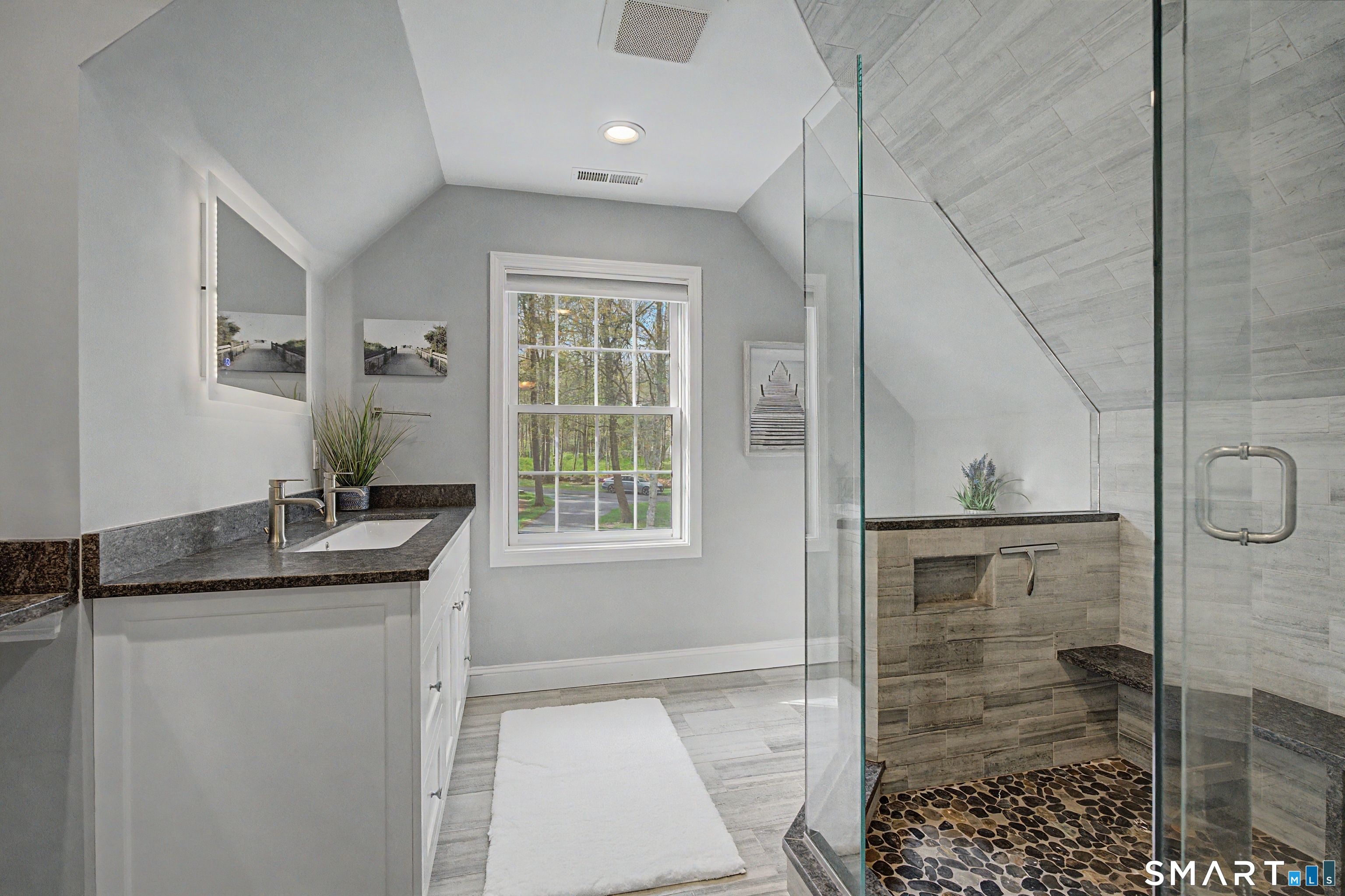 445 Dublin Road Southbury, CT 06488 - Photo 21 of 40 a bathroom with a granite countertop sink a mirror and shower