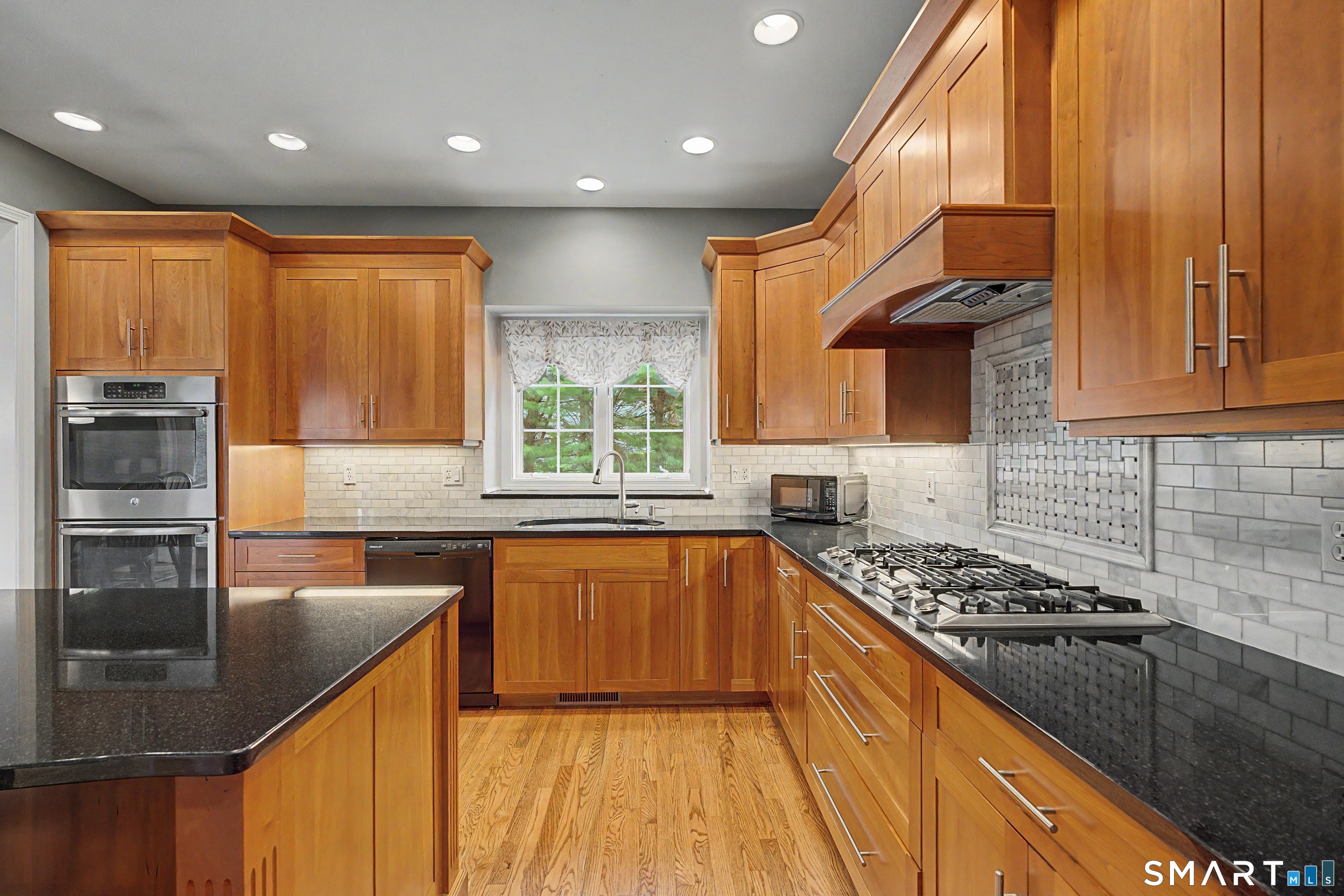 445 Dublin Road Southbury, CT 06488 - Photo 10 of 40 a kitchen with stainless steel appliances a sink stove and cabinets