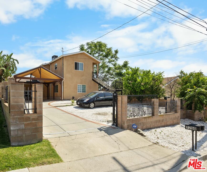 7752 Le Berthon Street Tujunga, CA 91042 - Photo 1 of 15 a front view of a house with a yard