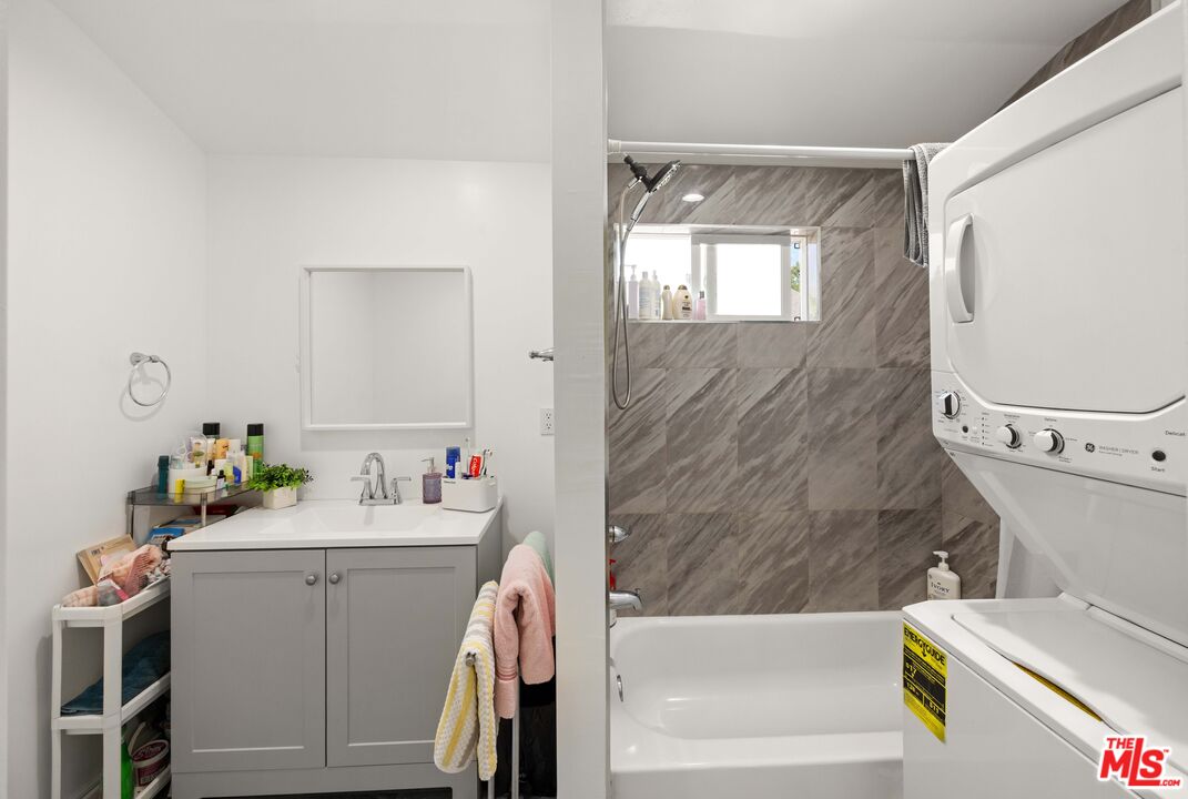 7752 Le Berthon Street Tujunga, CA 91042 - Photo 13 of 15 a bathroom with a sink mirror vanity and toilet