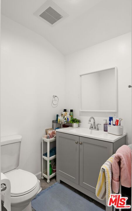 7752 Le Berthon Street Tujunga, CA 91042 - Photo 15 of 15 a bathroom with a toilet a sink and mirror