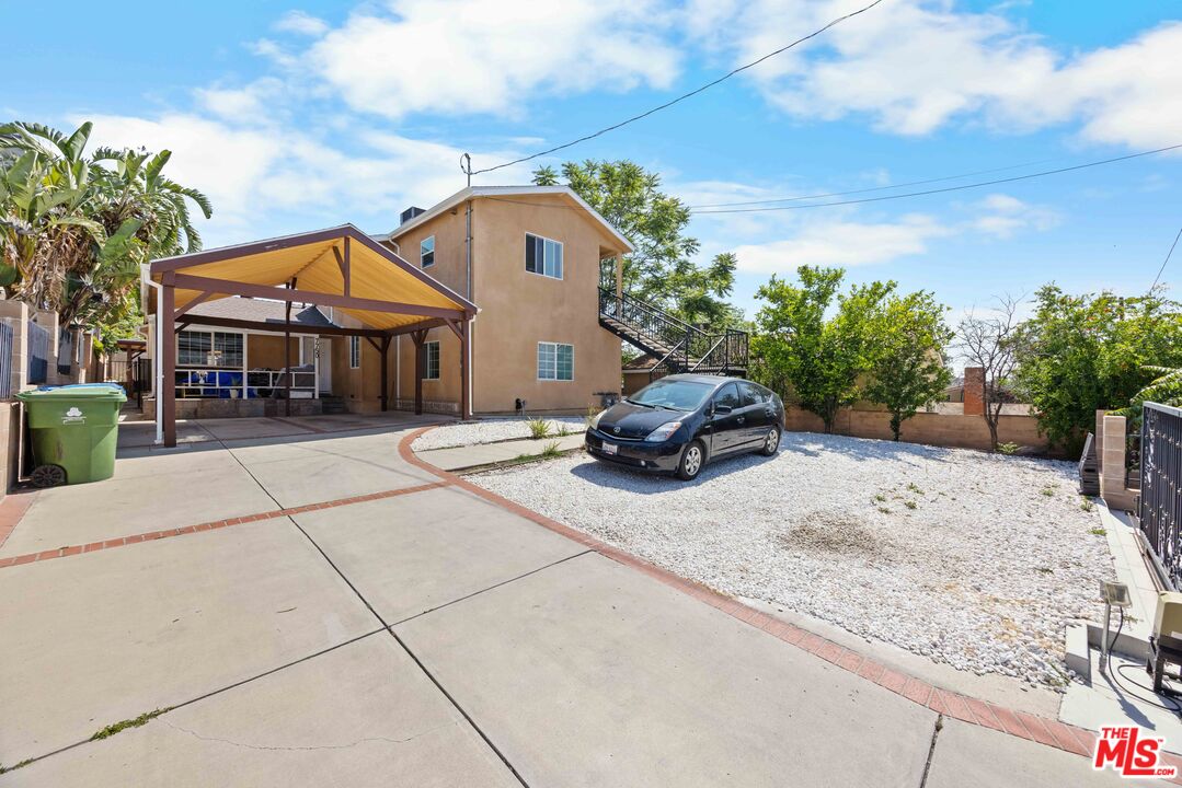 7752 Le Berthon Street Tujunga, CA 91042 - Photo 2 of 15 a car parked in front of house