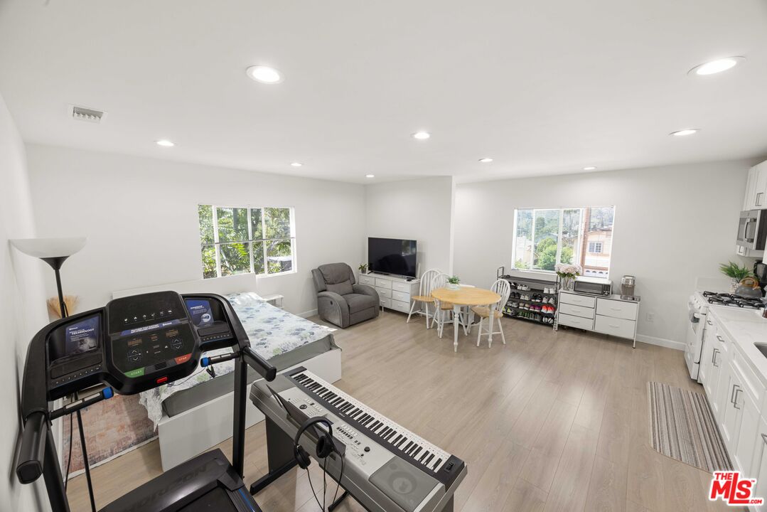 7752 Le Berthon Street Tujunga, CA 91042 - Photo 8 of 15 a living room with furniture and a flat screen tv