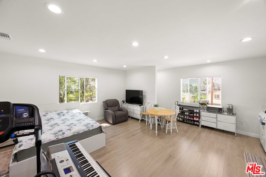 7752 Le Berthon Street Tujunga, CA 91042 - Photo 9 of 15 a living room with furniture and a flat screen tv