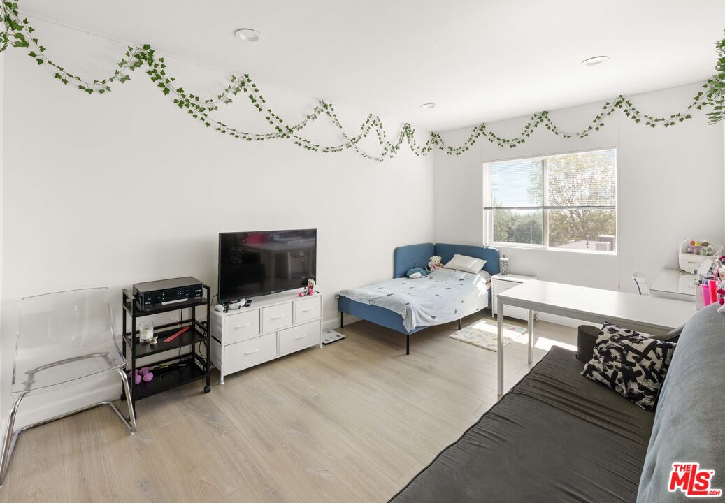7752 Le Berthon Street Tujunga, CA 91042 - Photo 10 of 15 a living room with furniture and a flat screen tv