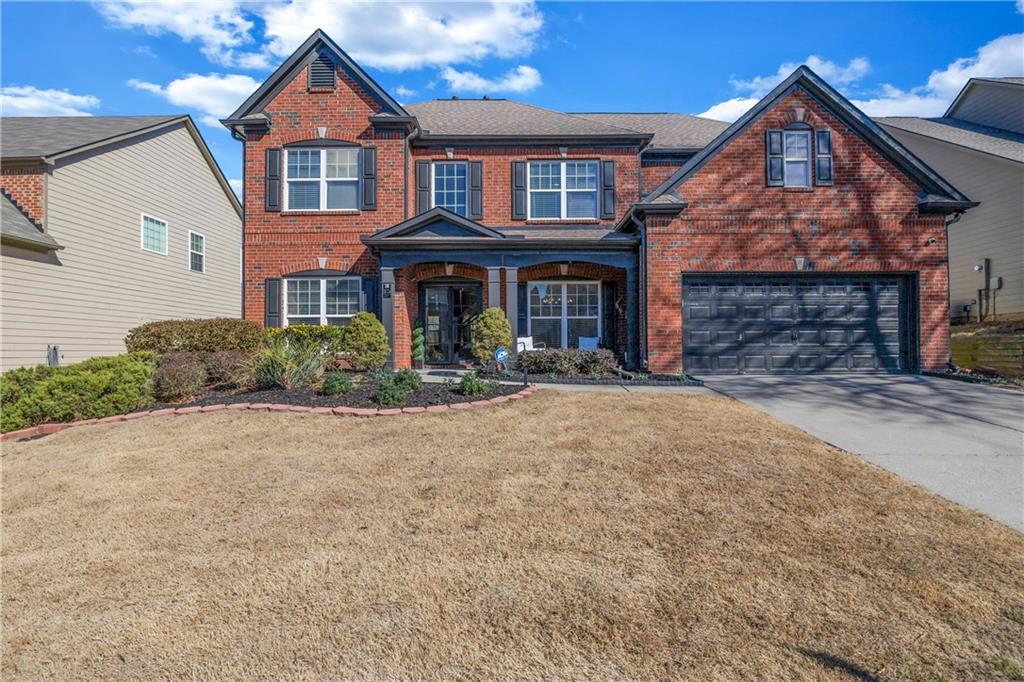 3721 Lake Enclave Way Atlanta, GA 30349 - Photo 1 of 1 a front view of a house wth yard and parking