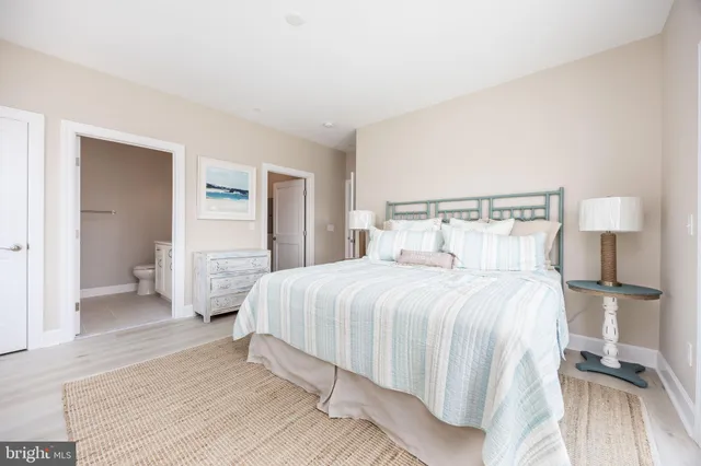 a bedroom with a bed and walk in closet