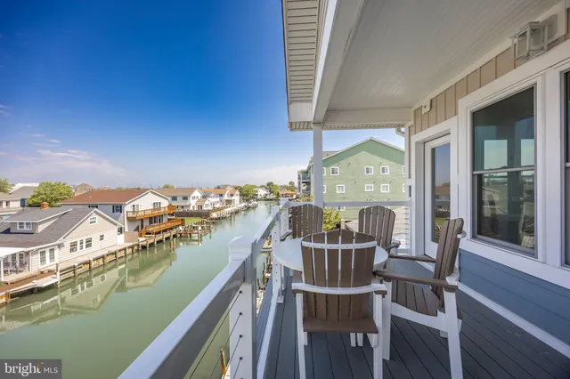 a view of a balcony with furniture
