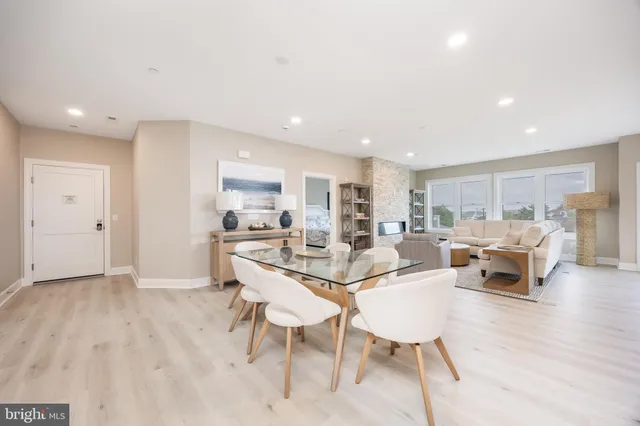 a view of a dining room with furniture window and wooden floor