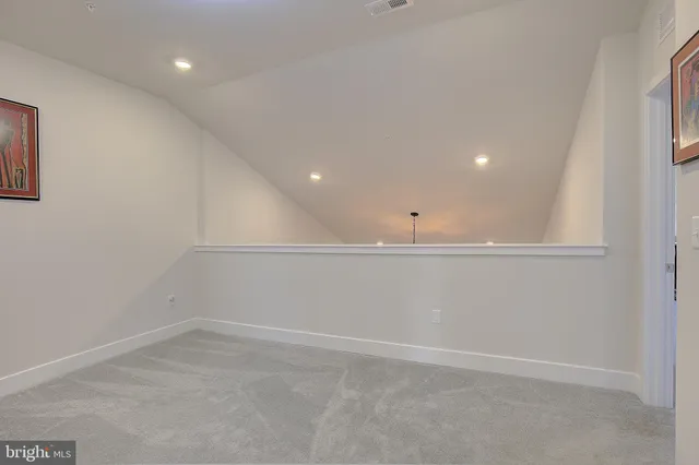 an empty room with a empty space and window