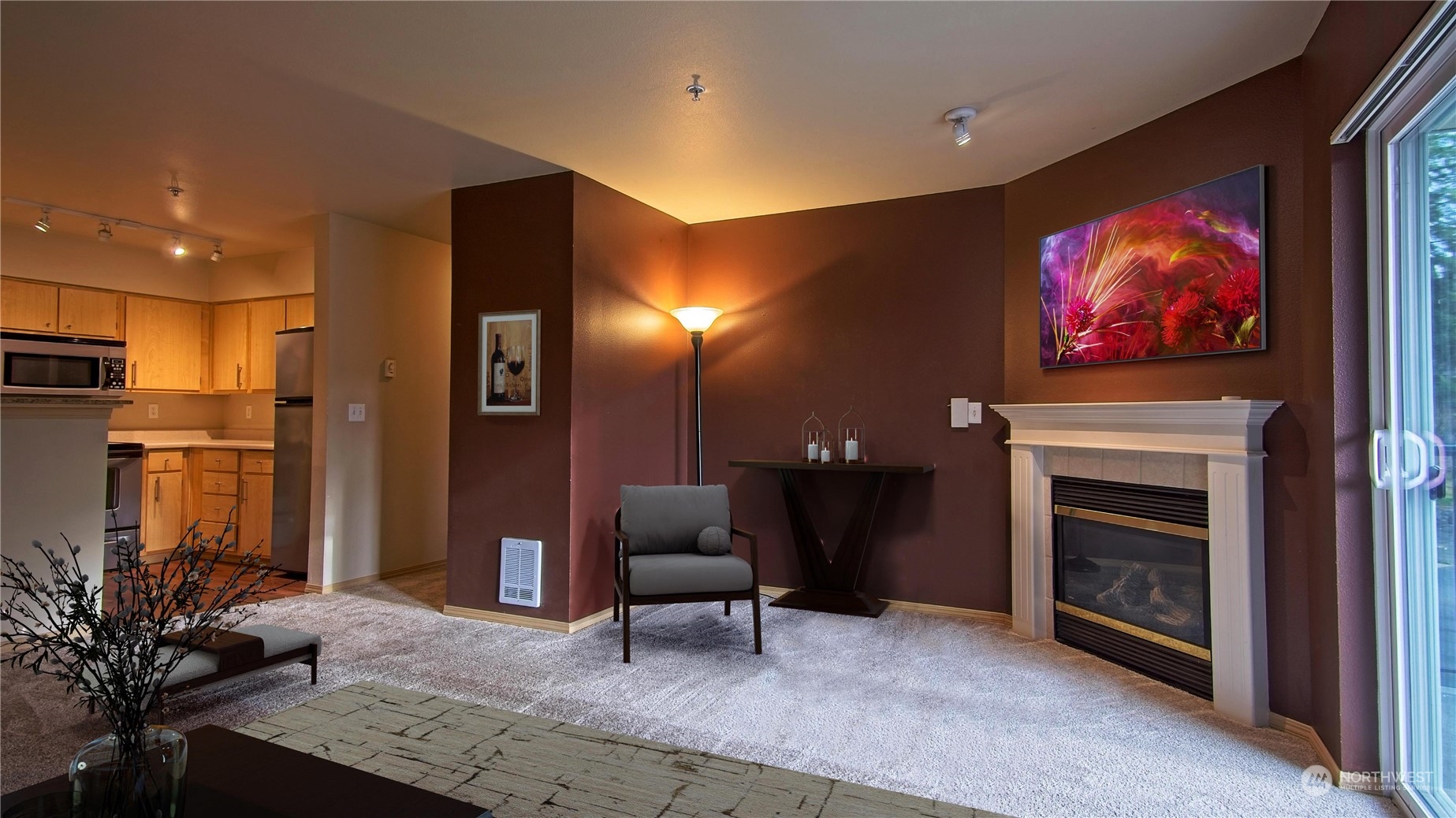 10709 Valley View Road, Unit A201 Bothell, WA 98011 - Photo 3 of 25 a living room with furniture a fireplace and a flat screen tv