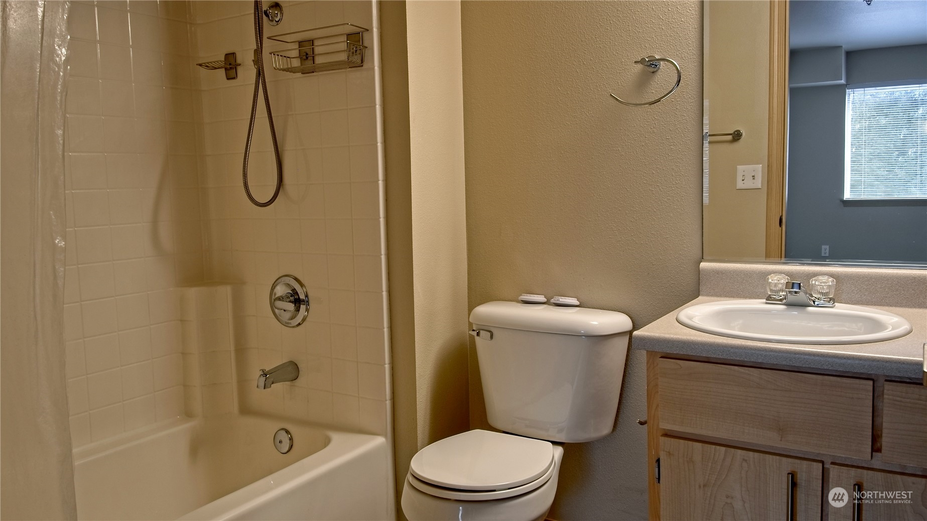 10709 Valley View Road, Unit A201 Bothell, WA 98011 - Photo 10 of 25 a bathroom with a sink toilet and shower