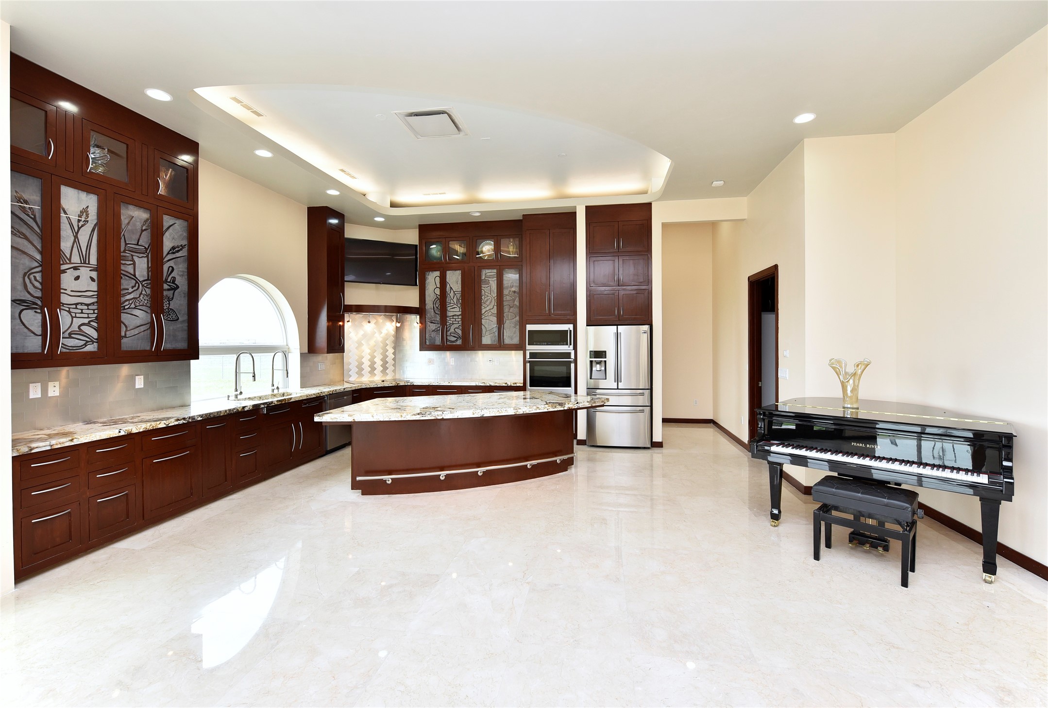 6602 Rohan Road Richmond, TX 77469 - Photo 13 of 49 a large living room with stainless steel appliances kitchen island granite countertop furniture and a view of living room