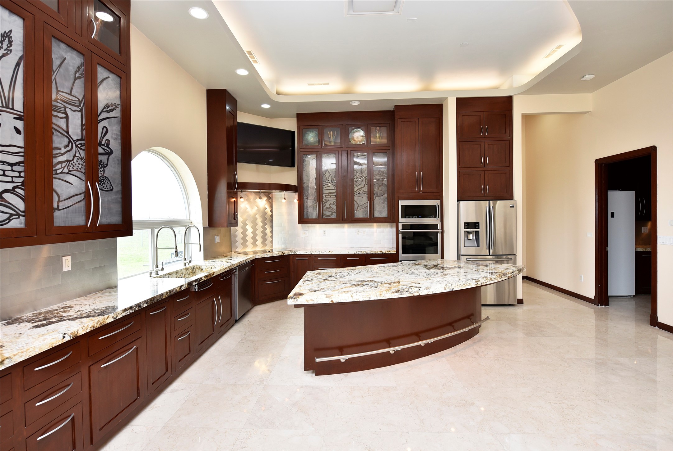 6602 Rohan Road Richmond, TX 77469 - Photo 15 of 49 a large kitchen with stainless steel appliances granite countertop a large counter top and a stove