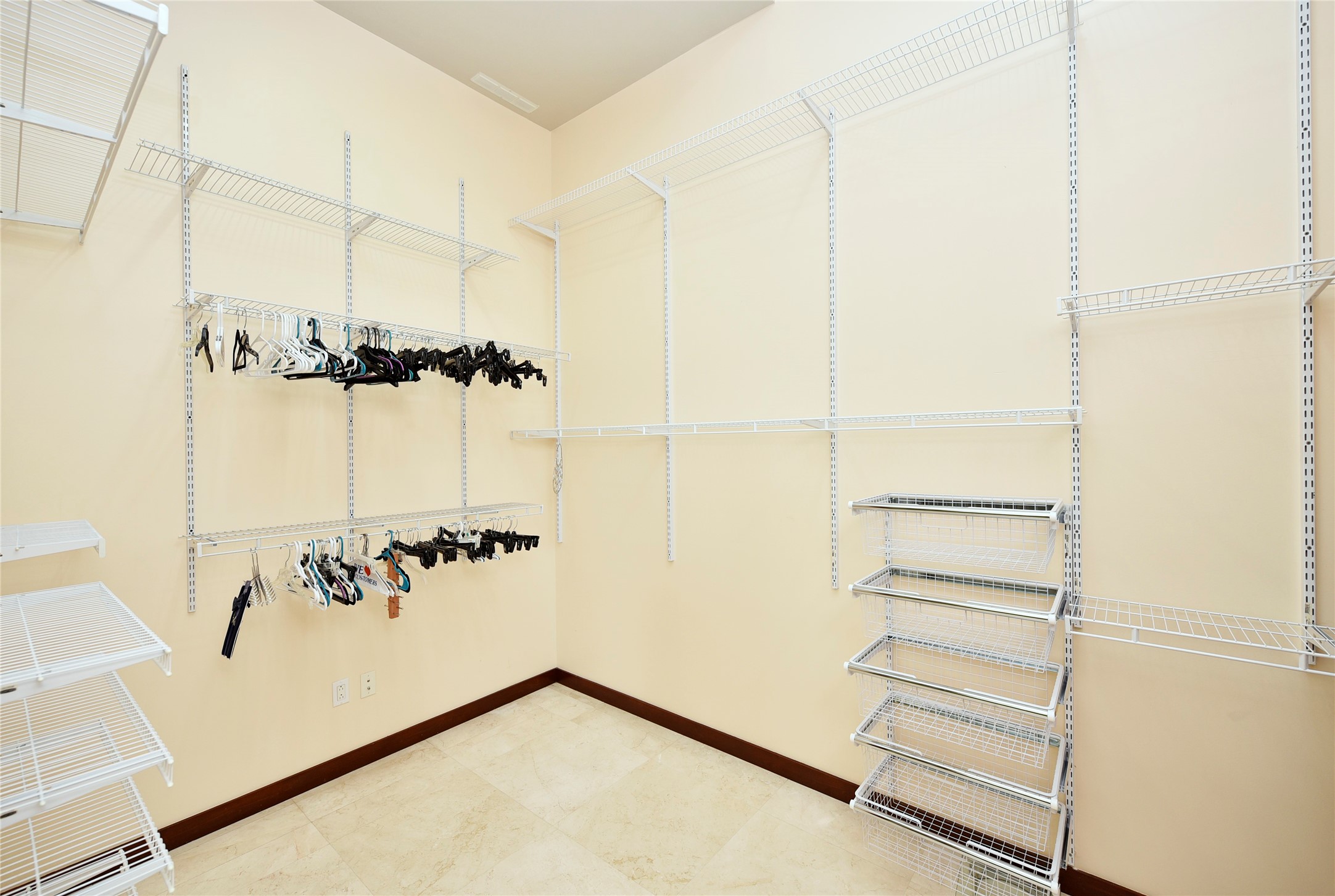 6602 Rohan Road Richmond, TX 77469 - Photo 22 of 49 a view of walk in closet with empty racks