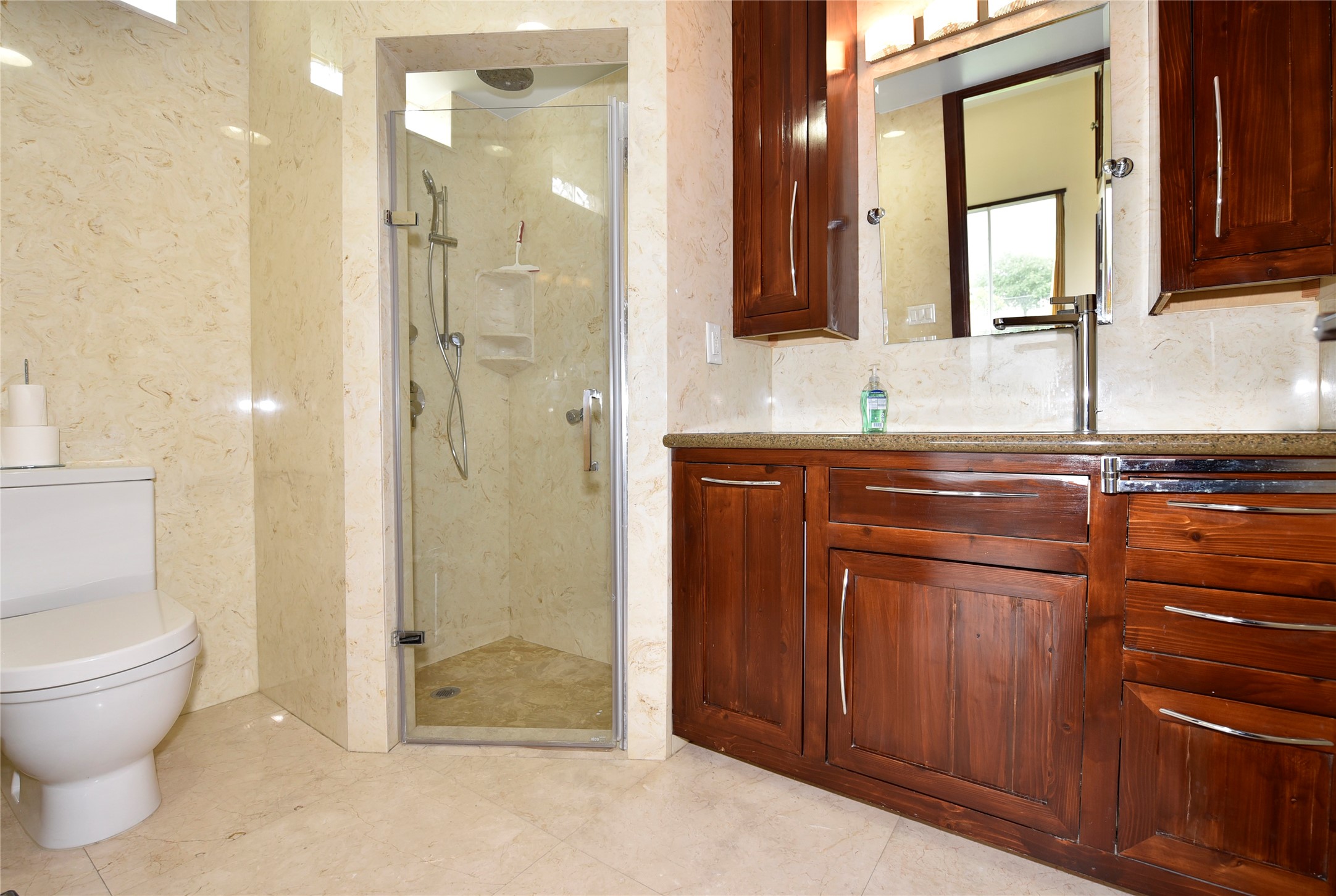 6602 Rohan Road Richmond, TX 77469 - Photo 29 of 49 a bathroom with a granite countertop sink toilet and shower