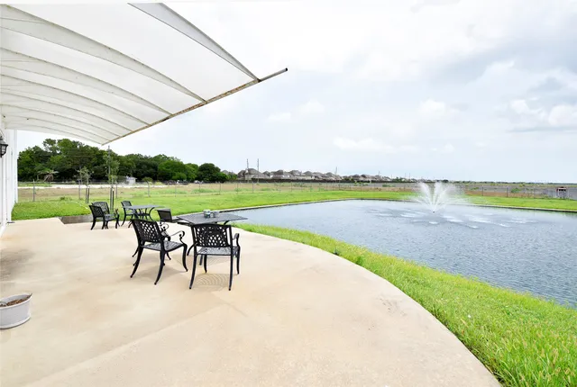 a view of a outdoor space with lounge chairs