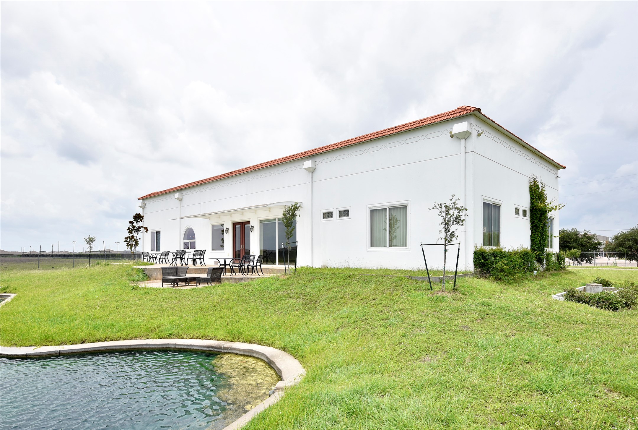 6602 Rohan Road Richmond, TX 77469 - Photo 38 of 49 a view of a house with a yard and sitting area
