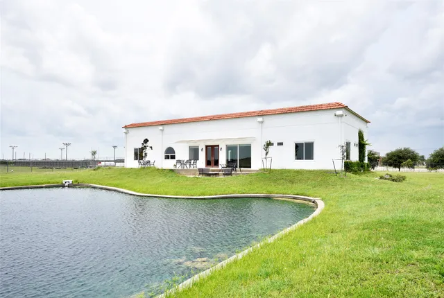 a view of a lake with houses in the back