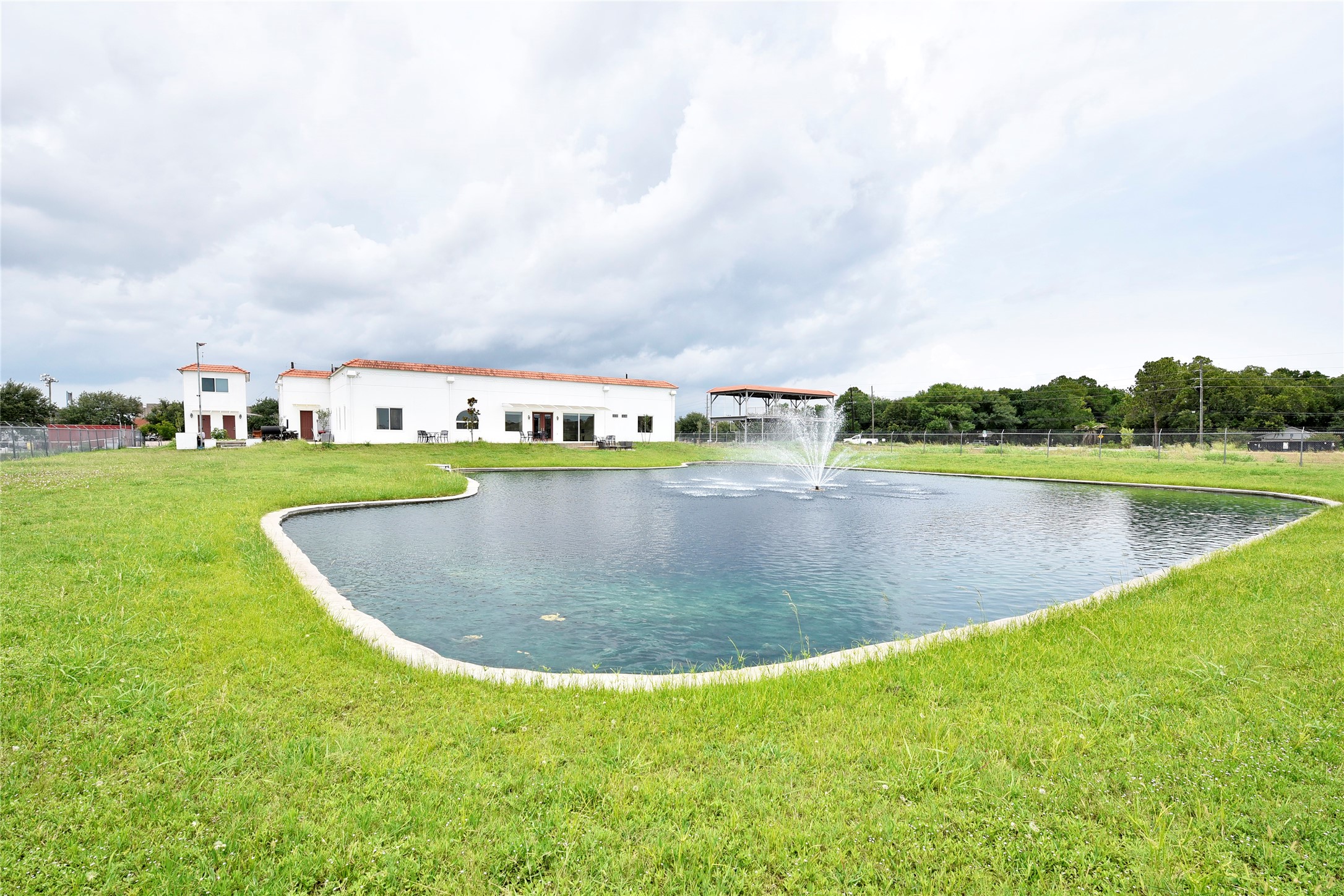 6602 Rohan Road Richmond, TX 77469 - Photo 41 of 49 a view of a lake with houses in the back