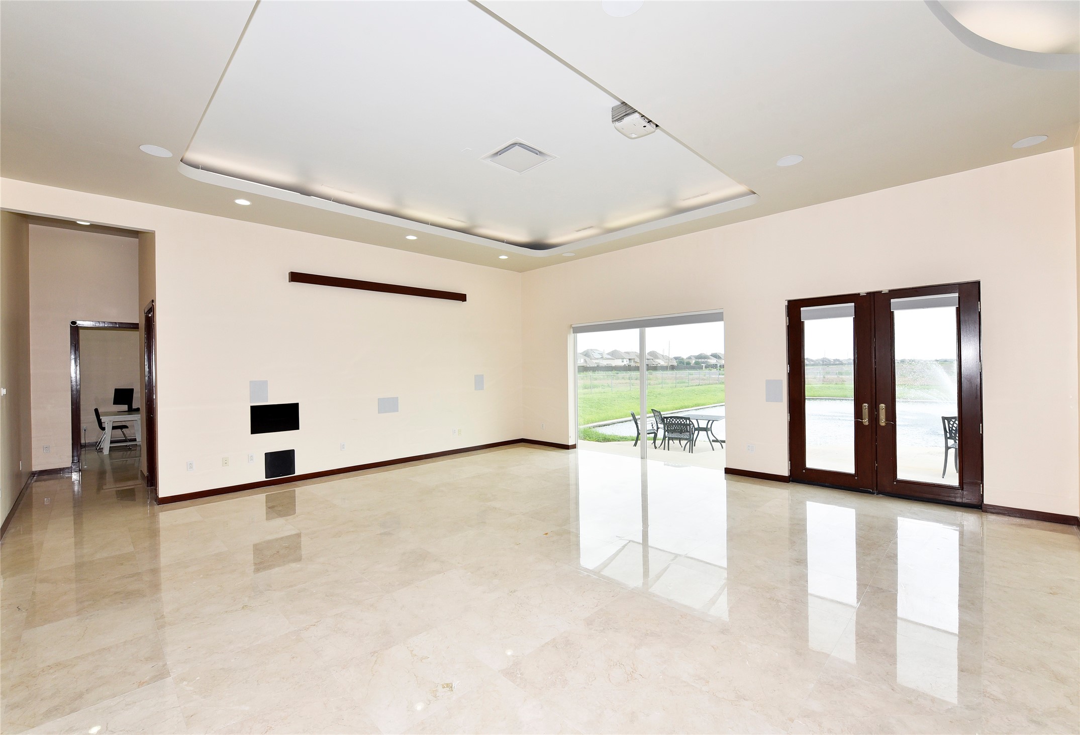 6602 Rohan Road Richmond, TX 77469 - Photo 8 of 49 a view of a big room with windows and chandelier