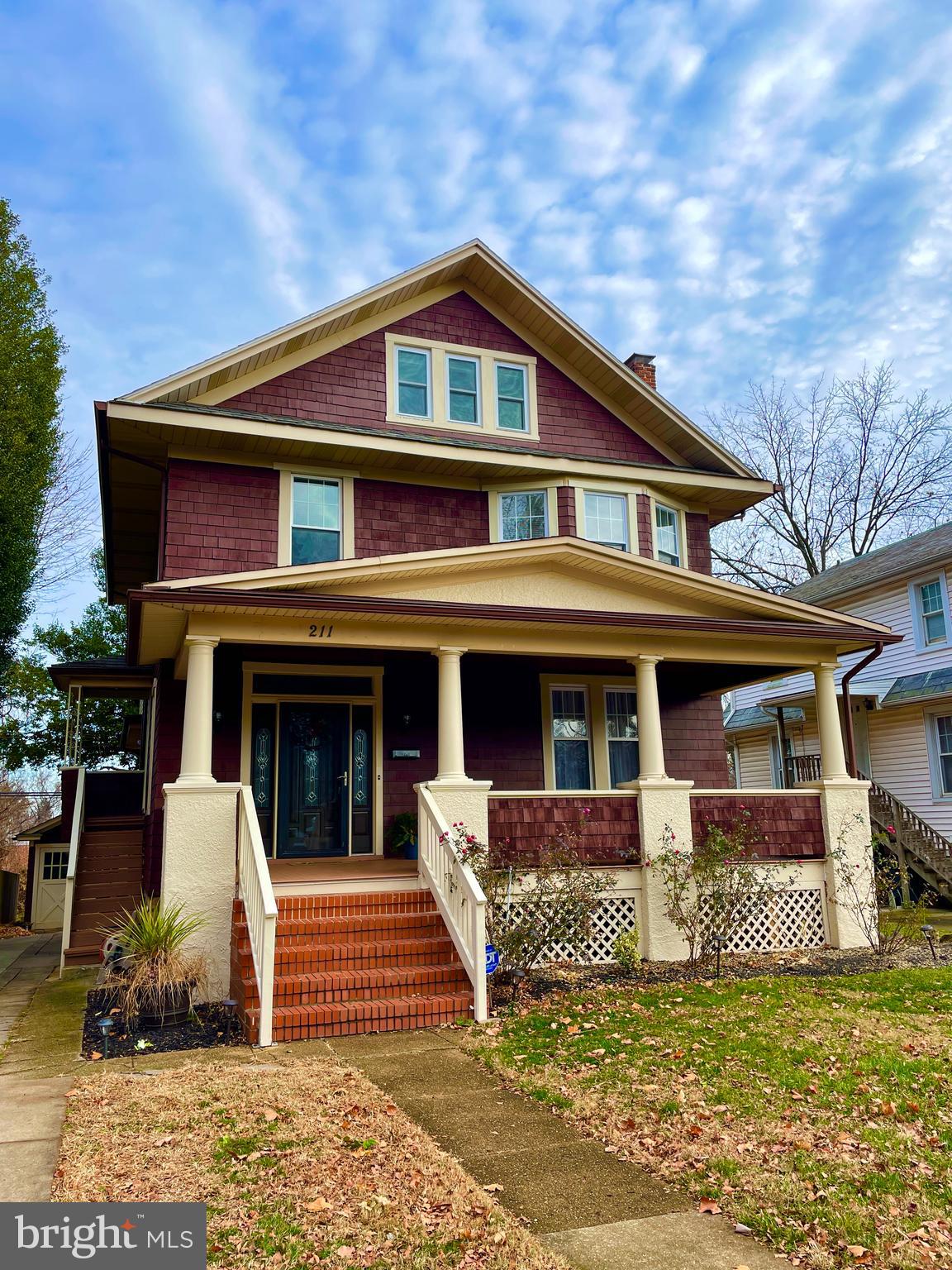 211 Mallow Hill Road Baltimore, MD 21229 - Photo 1 of 49 a front view of a house with garden