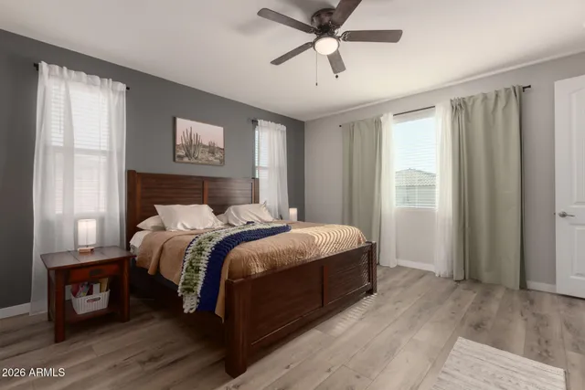 a bedroom with a large bed and a window