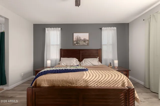 a bedroom with a bed and a window