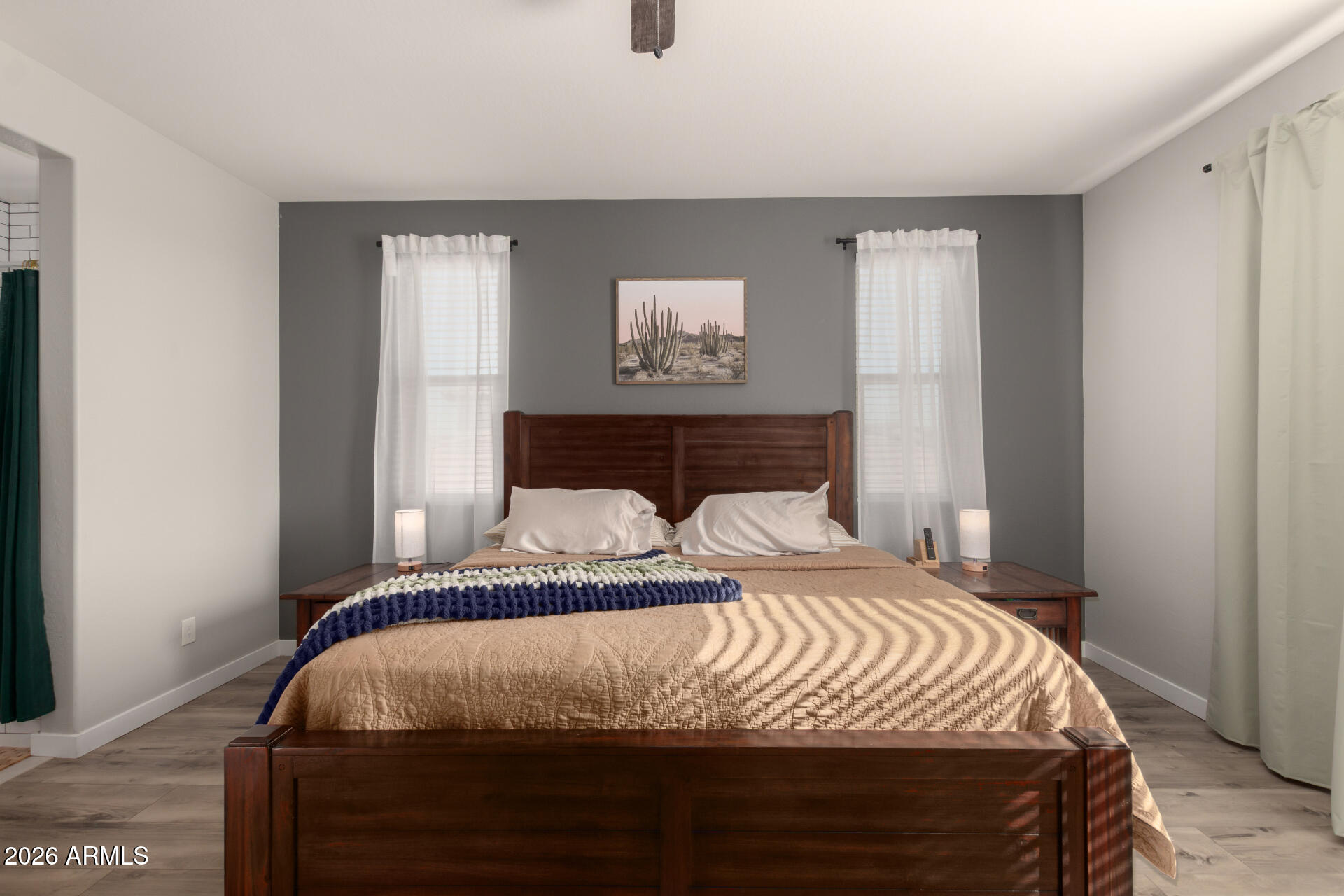 21073 West Berkeley Road Buckeye, AZ 85396 - Photo 17 of 41 a bedroom with a bed and a window