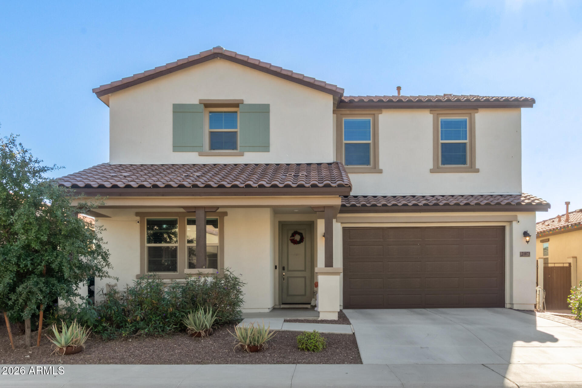 21073 West Berkeley Road Buckeye, AZ 85396 - Photo 2 of 41 a front view of a house with a garage