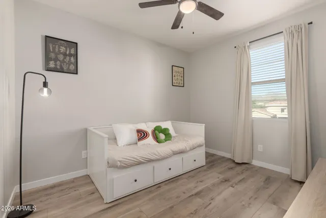 a bedroom with a bed and a window