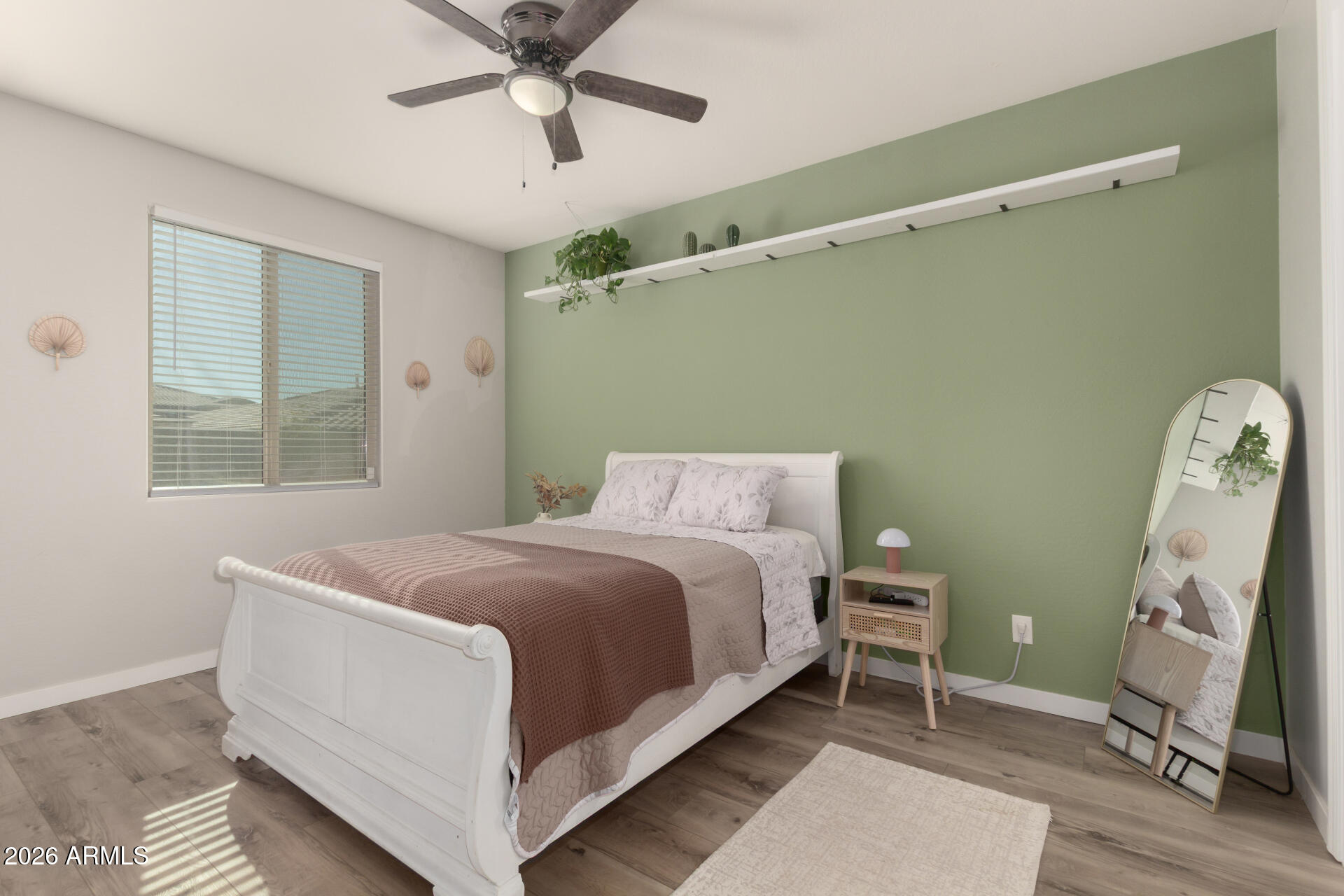 21073 West Berkeley Road Buckeye, AZ 85396 - Photo 26 of 41 a bed room with a bed and a window