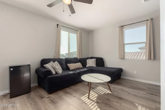 a living room with furniture and a window