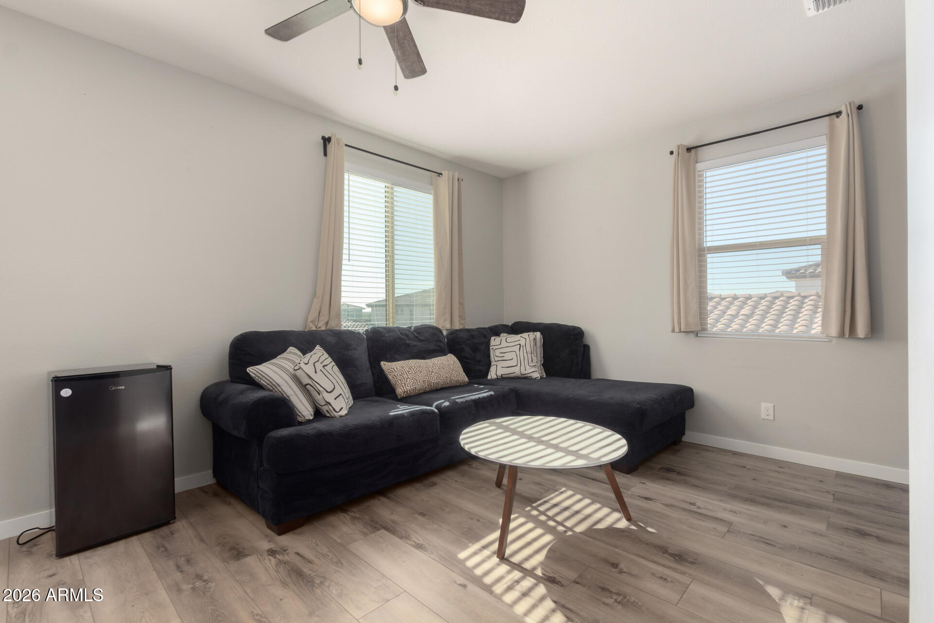 21073 West Berkeley Road Buckeye, AZ 85396 - Photo 27 of 41 a living room with furniture and a window