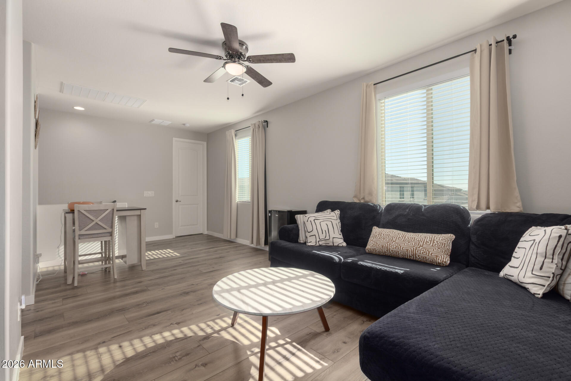 21073 West Berkeley Road Buckeye, AZ 85396 - Photo 36 of 41 a living room with furniture and a window