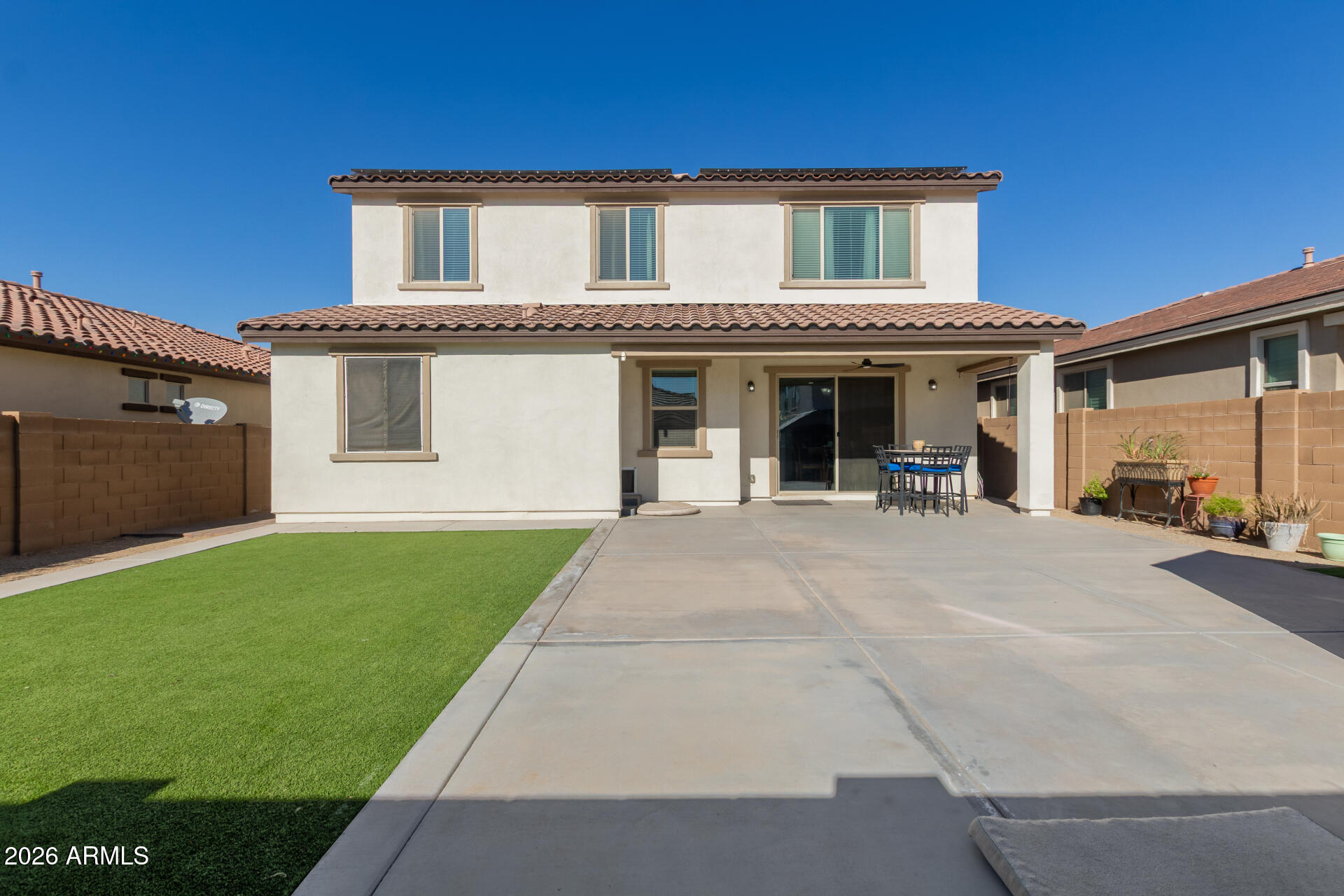 21073 West Berkeley Road Buckeye, AZ 85396 - Photo 38 of 41 a view of a house with a barbeque and large trees