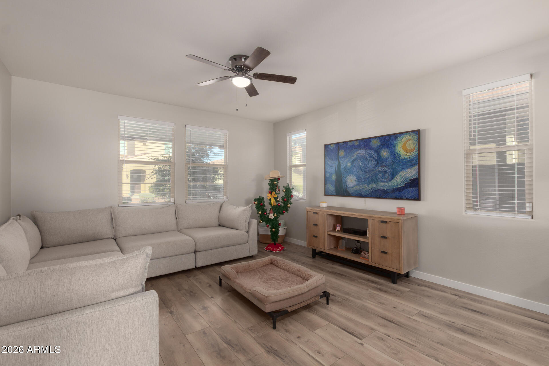 21073 West Berkeley Road Buckeye, AZ 85396 - Photo 5 of 41 a living room with furniture and a flat screen tv