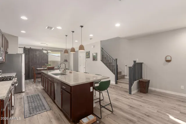 a kitchen with a table and chairs