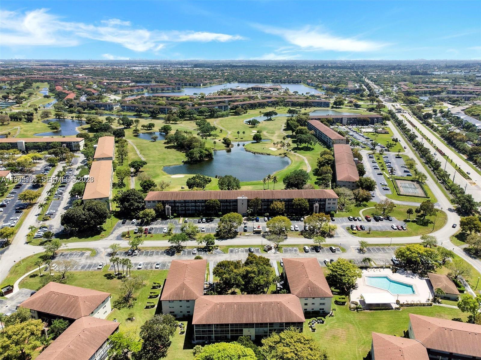 400 Southwest 134th Way, Unit 201F Pembroke Pines, FL 33027 - Photo 5 of 28 an aerial view of residential houses with outdoor space