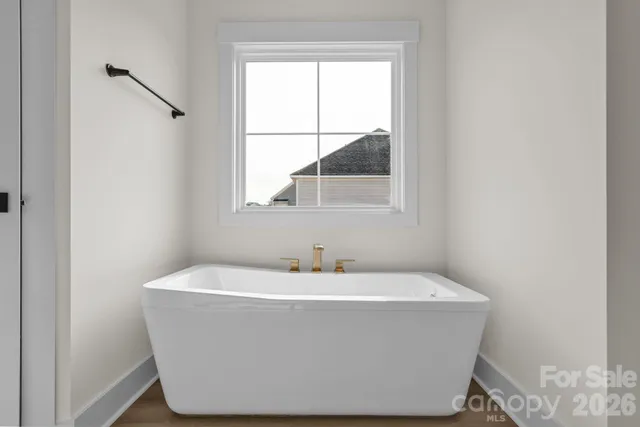 a white bath tub sitting in a bathroom